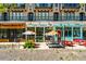 A collection of storefronts, each with its unique colorful design, awnings, and outdoor seating areas at 120 Beardon Se Cir # 2, Atlanta, GA 30316
