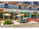 Eye-level view of charming commercial space with colorful picnic tables, umbrellas and outdoor seating at 120 Beardon Se Cir # 2, Atlanta, GA 30316