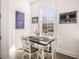 Bright dining area with table and chairs near a window, decorated with art at 120 Beardon Se Cir # 2, Atlanta, GA 30316