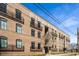 Beautifully restored brick building with black metal railings and large windows at 120 Beardon Se Cir # 2, Atlanta, GA 30316