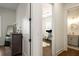 Hallway view of a bedroom, study, and bathroom featuring modern design and light fixtures at 120 Beardon Se Cir # 2, Atlanta, GA 30316