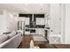 Well-lit kitchen featuring stainless appliances, white cabinets, and stylish black tile backsplash at 120 Beardon Se Cir # 2, Atlanta, GA 30316