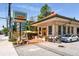 Exterior view of Muchacho restaurant with outdoor seating, brick and concrete exterior at 120 Beardon Se Cir # 2, Atlanta, GA 30316