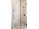Modern shower with glass door, white tile, and brass fixtures offers a luxurious experience at 120 Beardon Se Cir # 2, Atlanta, GA 30316
