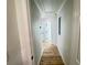 Hallway with wood-look flooring and neutral paint at 121 Thirkield Se Ave, Atlanta, GA 30315