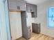 New kitchen cabinets in gray with a granite countertop and a modern backsplash at 121 Thirkield Se Ave, Atlanta, GA 30315