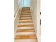 Wooden stairs leading to the upper floor, with a white banister, new construction at 121 Thirkield Se Ave, Atlanta, GA 30315