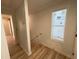 View of the stairway with wood-look flooring and a white handrail at 121 Thirkield Se Ave, Atlanta, GA 30315