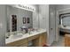 Bright bathroom features a dual sink vanity with ample counterspace and storage at 1258 Rocky Branch Trl, Lawrenceville, GA 30043