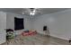 This bedroom has a ceiling fan and faux wood floors and is brightly lit with LED strip lights at 1258 Rocky Branch Trl, Lawrenceville, GA 30043