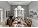 Elegant dining room with an ornate chandelier and wainscoting at 1258 Rocky Branch Trl, Lawrenceville, GA 30043