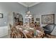 Elegant dining room with an ornate chandelier and wainscoting at 1258 Rocky Branch Trl, Lawrenceville, GA 30043