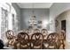Elegant dining room with an ornate chandelier and wainscoting at 1258 Rocky Branch Trl, Lawrenceville, GA 30043