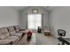 Inviting living room with contemporary furniture and soft natural light at 1258 Rocky Branch Trl, Lawrenceville, GA 30043