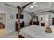 Spacious main bedroom features a tray ceiling, ornate bed frame, and ensuite bathroom at 1258 Rocky Branch Trl, Lawrenceville, GA 30043