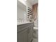 Modern bathroom featuring a gray vanity, decorative mirror, and stylish shower curtain at 4277 Azalea Ridge Way, Hoschton, GA 30548