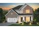 Charming two-story home with stone and brick accents, manicured landscaping, and a two-car garage at 4277 Azalea Ridge Way, Hoschton, GA 30548