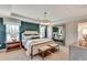 Serene main bedroom with decorative tray ceiling, ensuite, and lots of natural light at 4277 Azalea Ridge Way, Hoschton, GA 30548