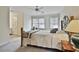 Cozy bedroom with neutral carpet, ceiling fan, and plenty of natural light from the two large windows at 1384 Sheffield Glen Ne Way, Atlanta, GA 30329