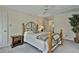 Comfortable bedroom with a ceiling fan, natural light, and a view to the adjoining bathroom and closet at 1384 Sheffield Glen Ne Way, Atlanta, GA 30329