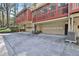 Exterior view of a home with multiple garage bays and rear screen porch at 1384 Sheffield Glen Ne Way, Atlanta, GA 30329