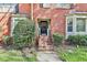 Brick front entrance with stairs leading to a black front door with the address 1384 at 1384 Sheffield Glen Ne Way, Atlanta, GA 30329