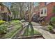 Landscaped front yard featuring stone walkways and lush green spaces enhancing curb appeal at 1384 Sheffield Glen Ne Way, Atlanta, GA 30329
