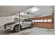 Attached garage showing a car, ample space, and an automatic door opener at 1384 Sheffield Glen Ne Way, Atlanta, GA 30329