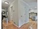 Hallway view with hardwood floors leading to the kitchen and a view to the living room fireplace at 1384 Sheffield Glen Ne Way, Atlanta, GA 30329