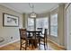 Kitchen nook with a built-in dining table, wood floors, and bright windows at 1384 Sheffield Glen Ne Way, Atlanta, GA 30329