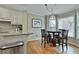 Bright eat-in kitchen nook featuring a built-in dining set and multiple windows for natural light at 1384 Sheffield Glen Ne Way, Atlanta, GA 30329