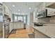 Bright kitchen with stainless steel appliances, light cabinets, granite countertops, and hardwood floors at 1384 Sheffield Glen Ne Way, Atlanta, GA 30329