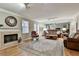 Bright living room featuring a fireplace, a rocking chair, and a mirrored wall at 1384 Sheffield Glen Ne Way, Atlanta, GA 30329