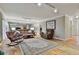 Spacious living room featuring a rocking chair, a coffee table, and a mirrored wall at 1384 Sheffield Glen Ne Way, Atlanta, GA 30329