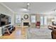 Spacious living room with fireplace, large windows, and hardwood floors at 1384 Sheffield Glen Ne Way, Atlanta, GA 30329