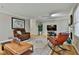 Bright living room featuring a painting, a modern television, and a rocking chair at 1384 Sheffield Glen Ne Way, Atlanta, GA 30329