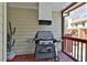 Enjoy outdoor cooking on this screened porch featuring a convenient built-in grill with vent hood at 1384 Sheffield Glen Ne Way, Atlanta, GA 30329