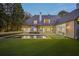 Beautiful backyard showcasing the pool, lawn, and access to the house's interior through sliding glass doors at 3364 Knollwood Nw Dr, Atlanta, GA 30305
