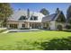 Sprawling backyard showcasing a pool, manicured lawn, and the elegant home's exterior at 3364 Knollwood Nw Dr, Atlanta, GA 30305