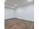 Clean, unfinished basement with a smooth concrete floor, recessed lighting, and white walls, perfect for customization at 3364 Knollwood Nw Dr, Atlanta, GA 30305