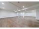 Expansive basement with light flooring, recessed lighting, and structural columns, ready to be customized and enjoyed at 3364 Knollwood Nw Dr, Atlanta, GA 30305