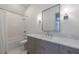 Modern bathroom with a gray vanity, marble countertop, sleek fixtures, and a shower/tub combo perfect for relaxation at 3364 Knollwood Nw Dr, Atlanta, GA 30305