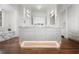 Bright bathroom features marble countertops, custom cabinetry, and modern fixtures for a luxurious and spa-like experience at 3364 Knollwood Nw Dr, Atlanta, GA 30305