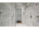 Bathroom with a walk-in shower and marble walls at 3364 Knollwood Nw Dr, Atlanta, GA 30305