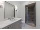 Bathroom featuring a vanity with marble countertop and walk-in shower at 3364 Knollwood Nw Dr, Atlanta, GA 30305