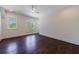 Bedroom featuring hardwood floors, large windows allowing natural light and neutral color palette at 3364 Knollwood Nw Dr, Atlanta, GA 30305