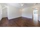 Spacious bedroom with gleaming hardwood floors, ceiling fan, and white trim at 3364 Knollwood Nw Dr, Atlanta, GA 30305