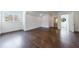 Spacious bedroom boasts hardwood floors, a large window, and an ensuite bathroom with natural light, creating a serene retreat at 3364 Knollwood Nw Dr, Atlanta, GA 30305