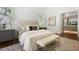 Stylish bedroom features hardwood floors, comfortable bedding, and natural light creating a peaceful and inviting space at 3364 Knollwood Nw Dr, Atlanta, GA 30305