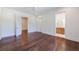 Bedroom with hardwood floors and doors leading to a bathroom and hall at 3364 Knollwood Nw Dr, Atlanta, GA 30305
